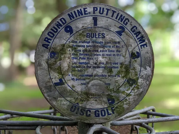 Weathered disc golf sign from the Winskill course